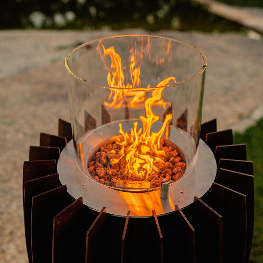 GlammFire Tuli Gas Heater — styled in a garden setting
