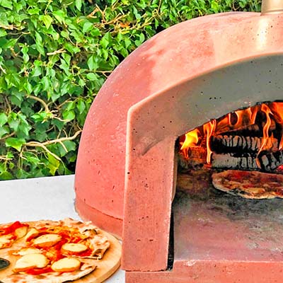 Igneus Ceramiko 600 Wood Fired Pizza Oven — in a patio setting