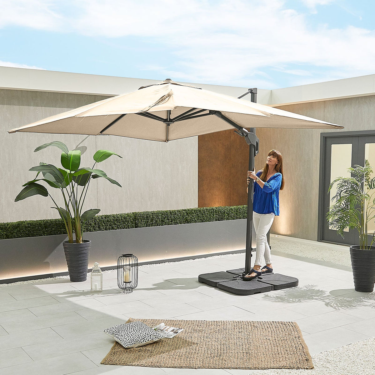 Genesis Grey Frame Cantilever Parasol — in use outdoors
