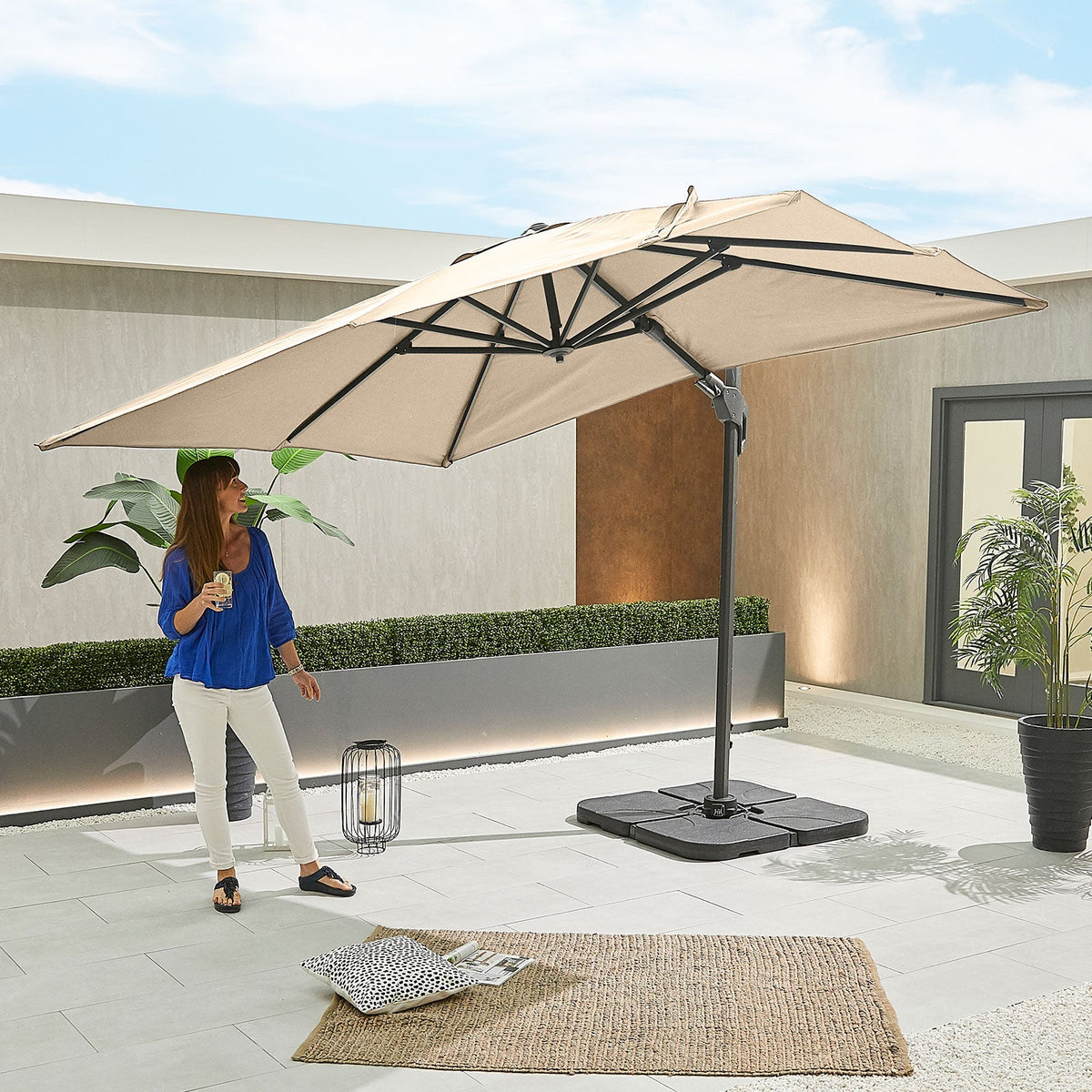 Genesis Grey Frame Cantilever Parasol — in a patio setting