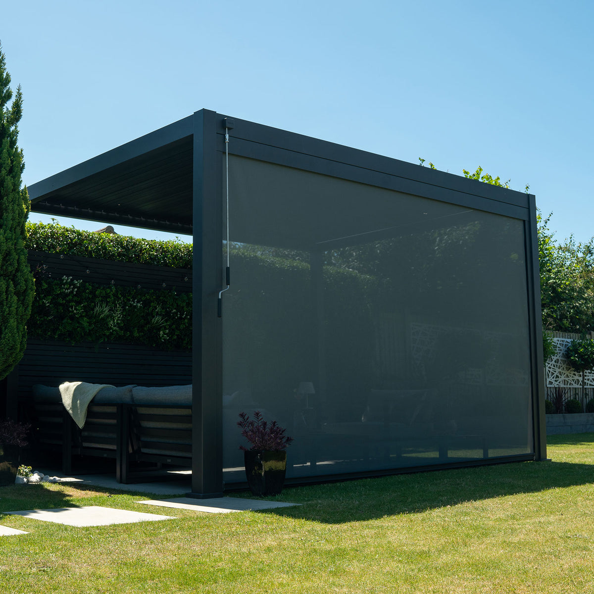 Titan Pergola Pull Down Privacy Screen — in a patio setting