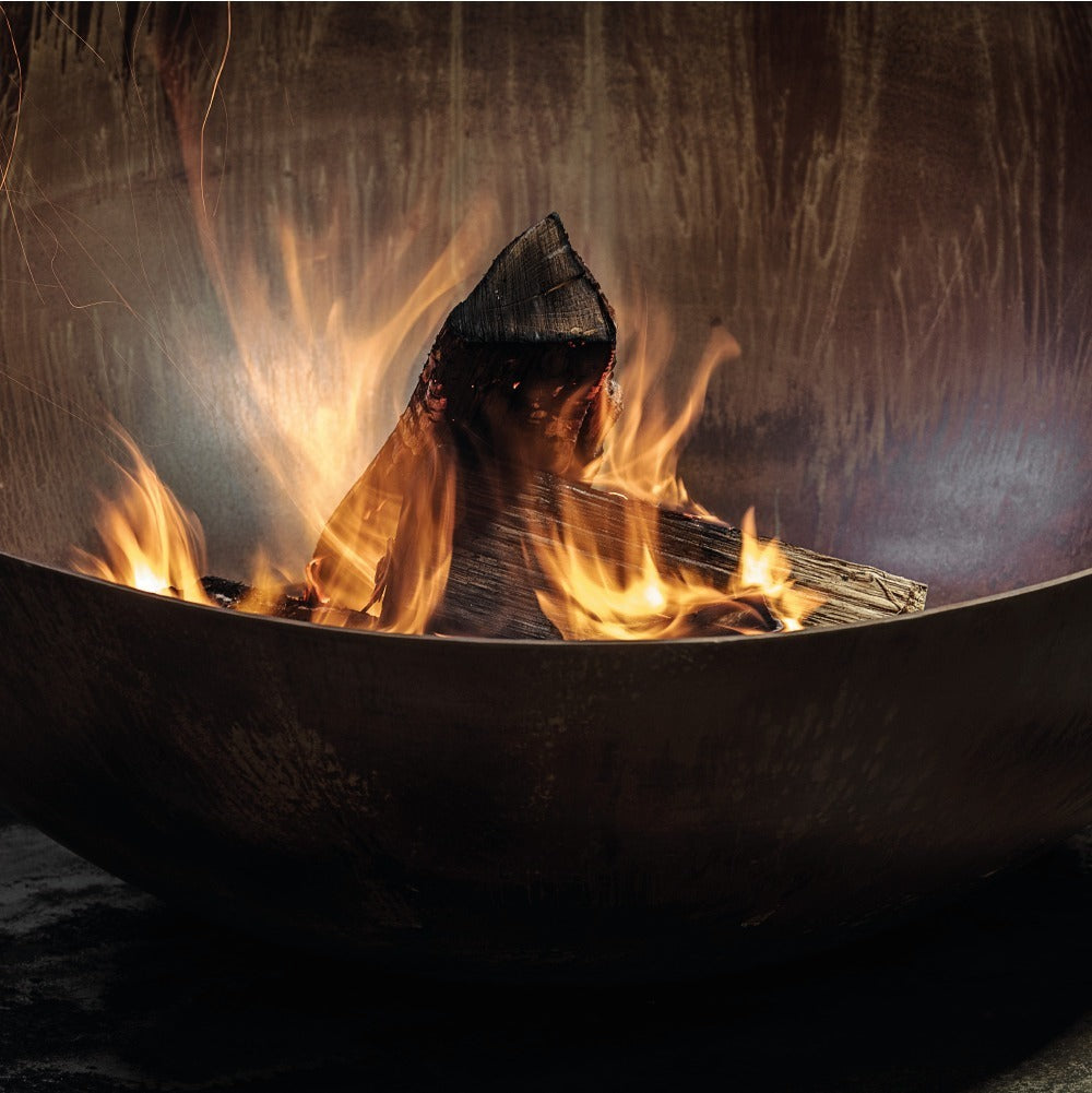 GlammFire Solace Fire Pit — styled in a garden setting