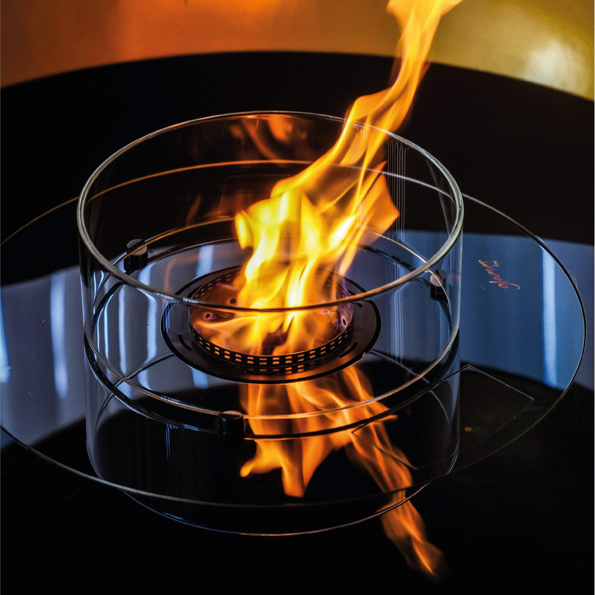 Glammfire Thales Suspended Fire — styled in a garden setting