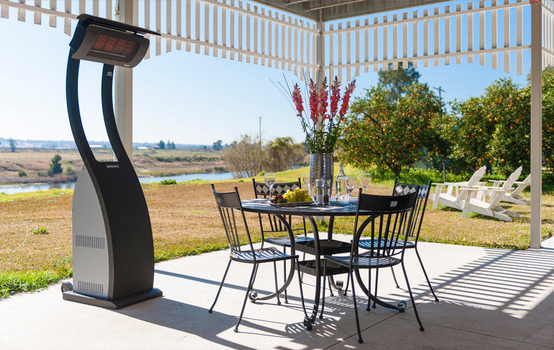 Bromic Tungsten Smart-Heat Portable beside a patio dining table | Roma Verandas