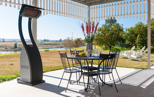 Bromic Tungsten Smart-Heat Portable beside a patio dining table | Roma Verandas